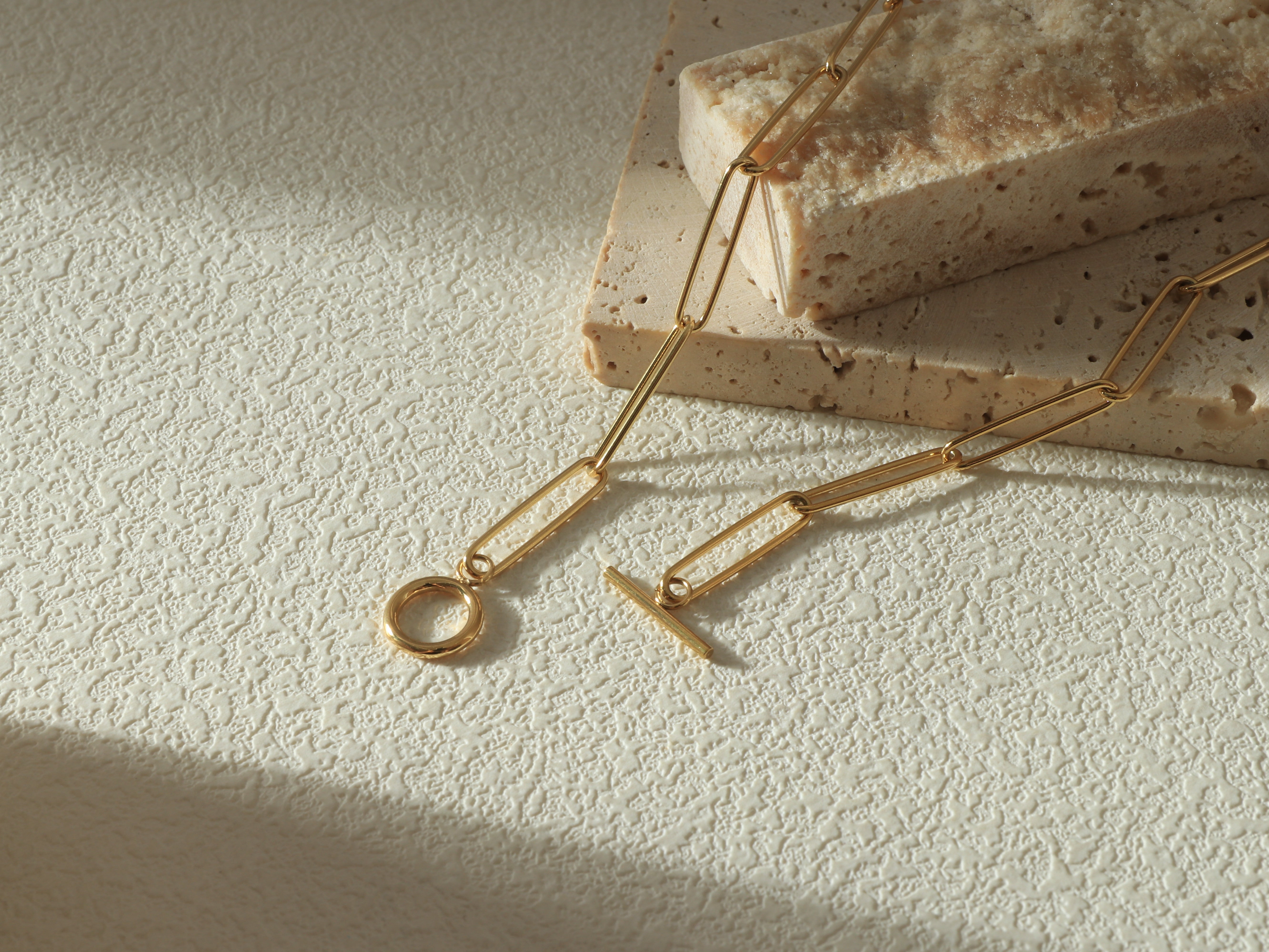 Close-up flat lay of the Unity Chain, focusing on the 14k gold links closure pattern - Gold coated on stainless steel base