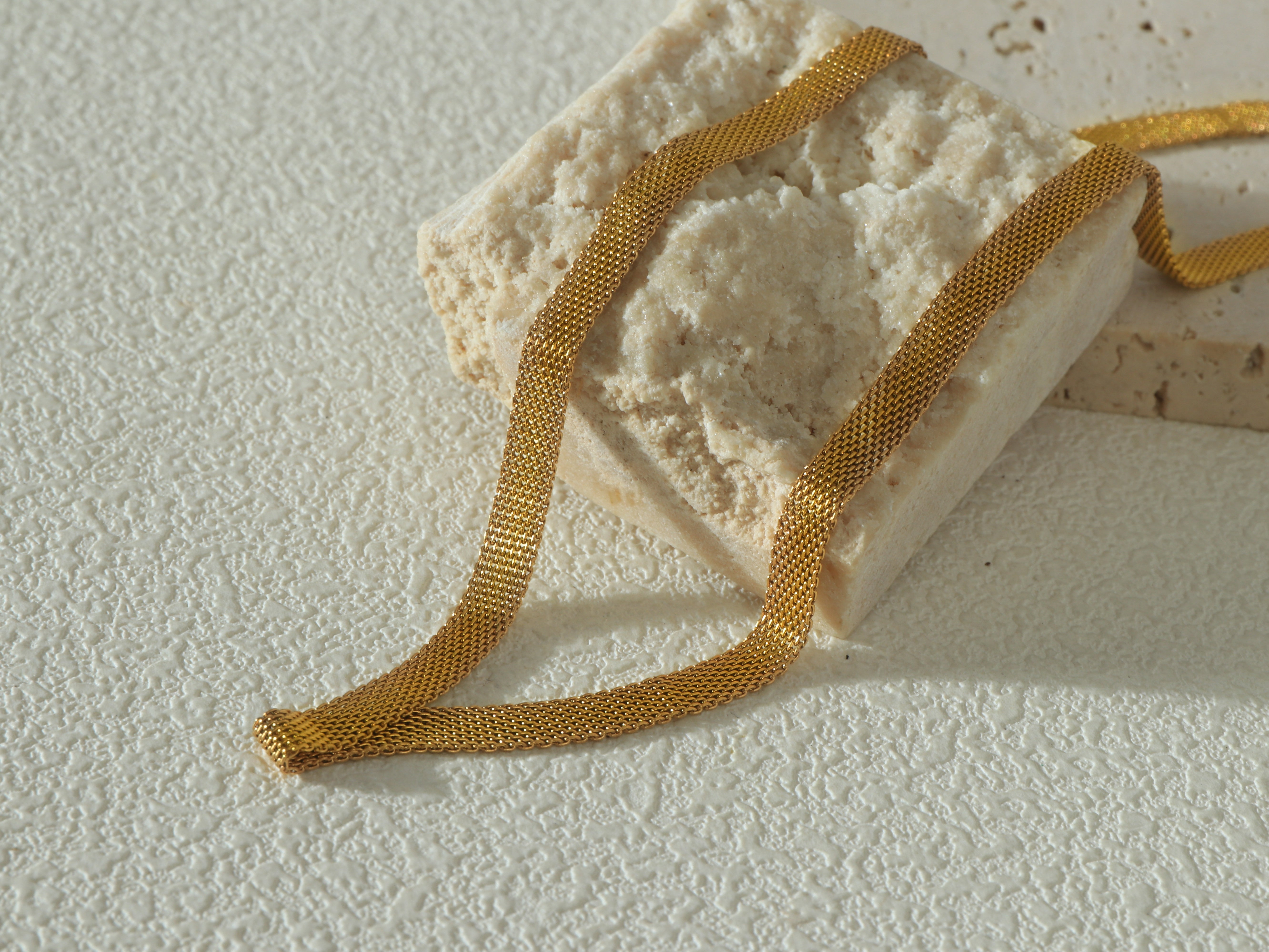 Close-up of the Gold Dominion Necklace showing the 14k gold coated over stainless steel.