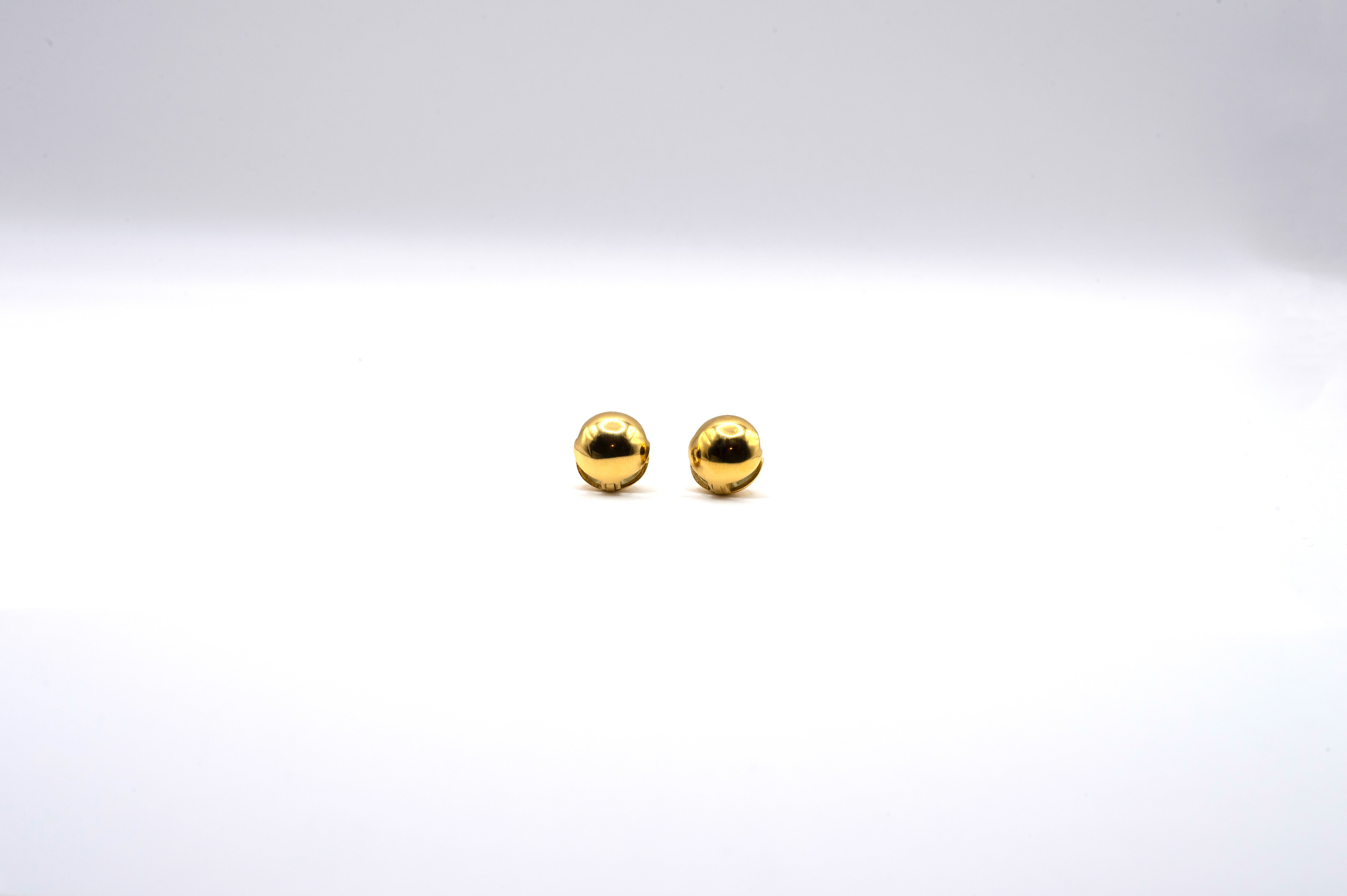 Orb Huggies in 18k real gold on stainless steel, displayed on white background.