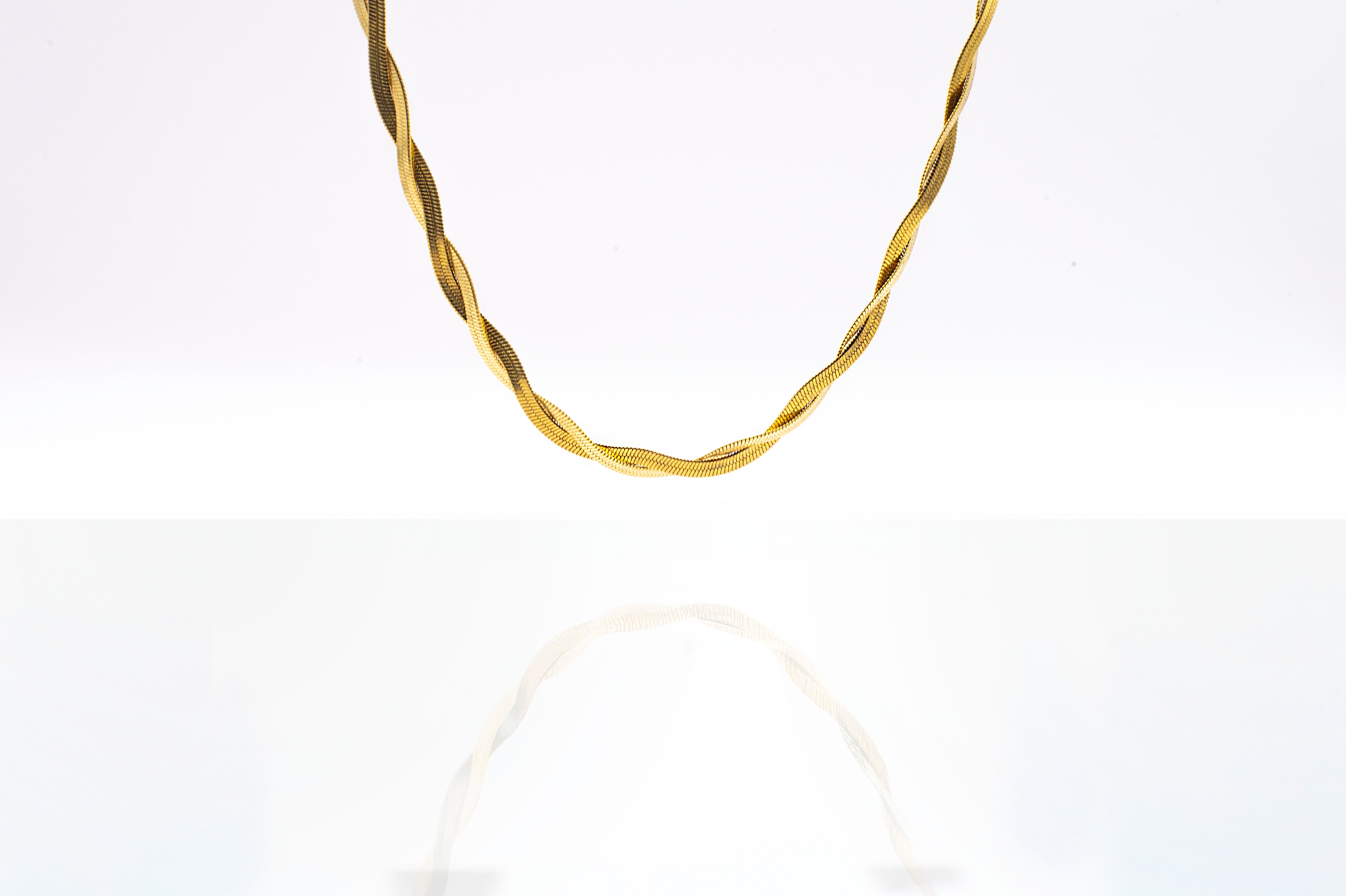 Close up of the Empress Gold Necklace displayed on a white background - 18k real gold finish and 40cm length