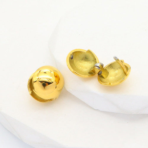 Close-up of Orb Gold Huggies showing their rounded shape, closure design, waterproof gold coating, and scratch-resistant surface.