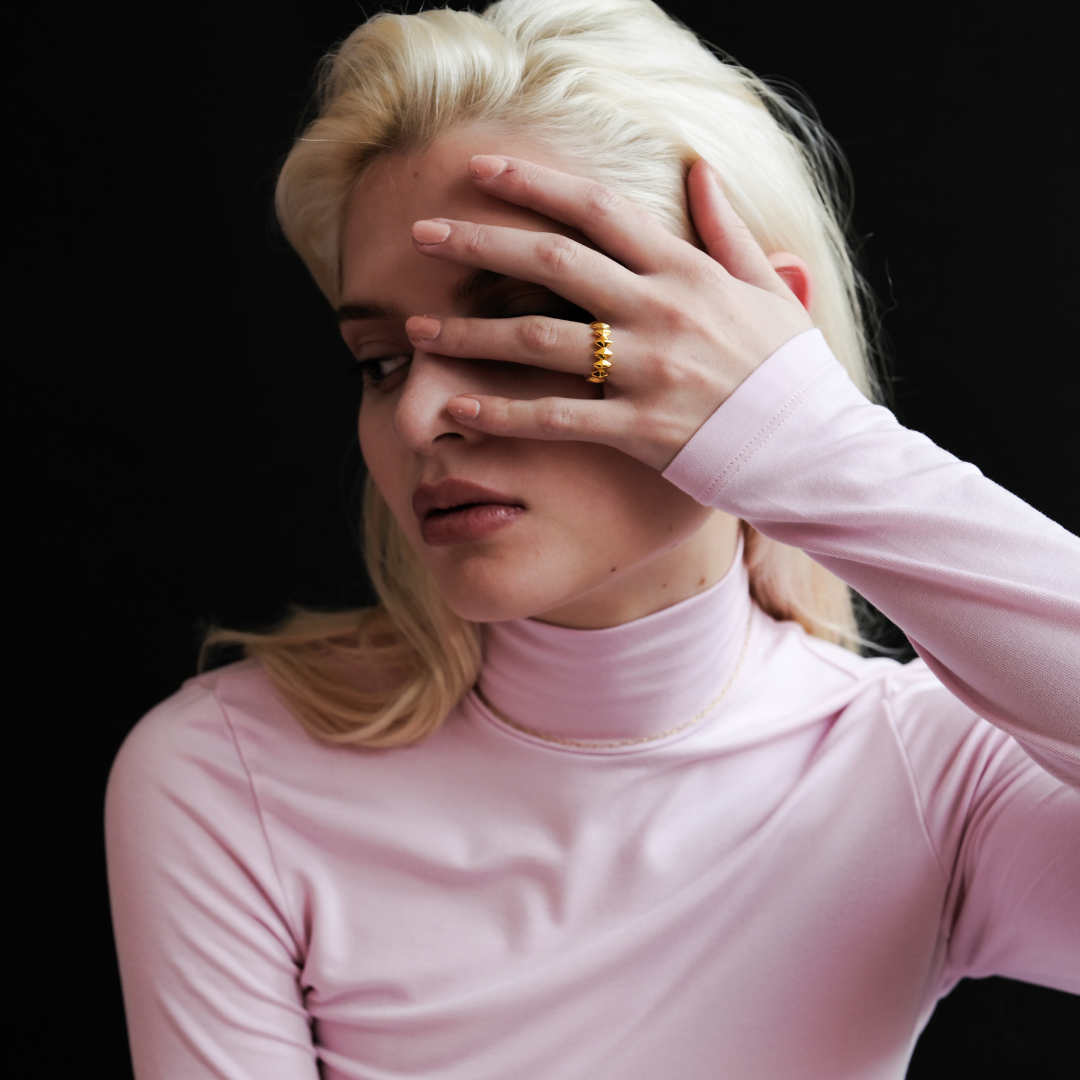 Edgy Gold Ring worn by model, showcasing its bold 18k gold design, smooth surface and fit.