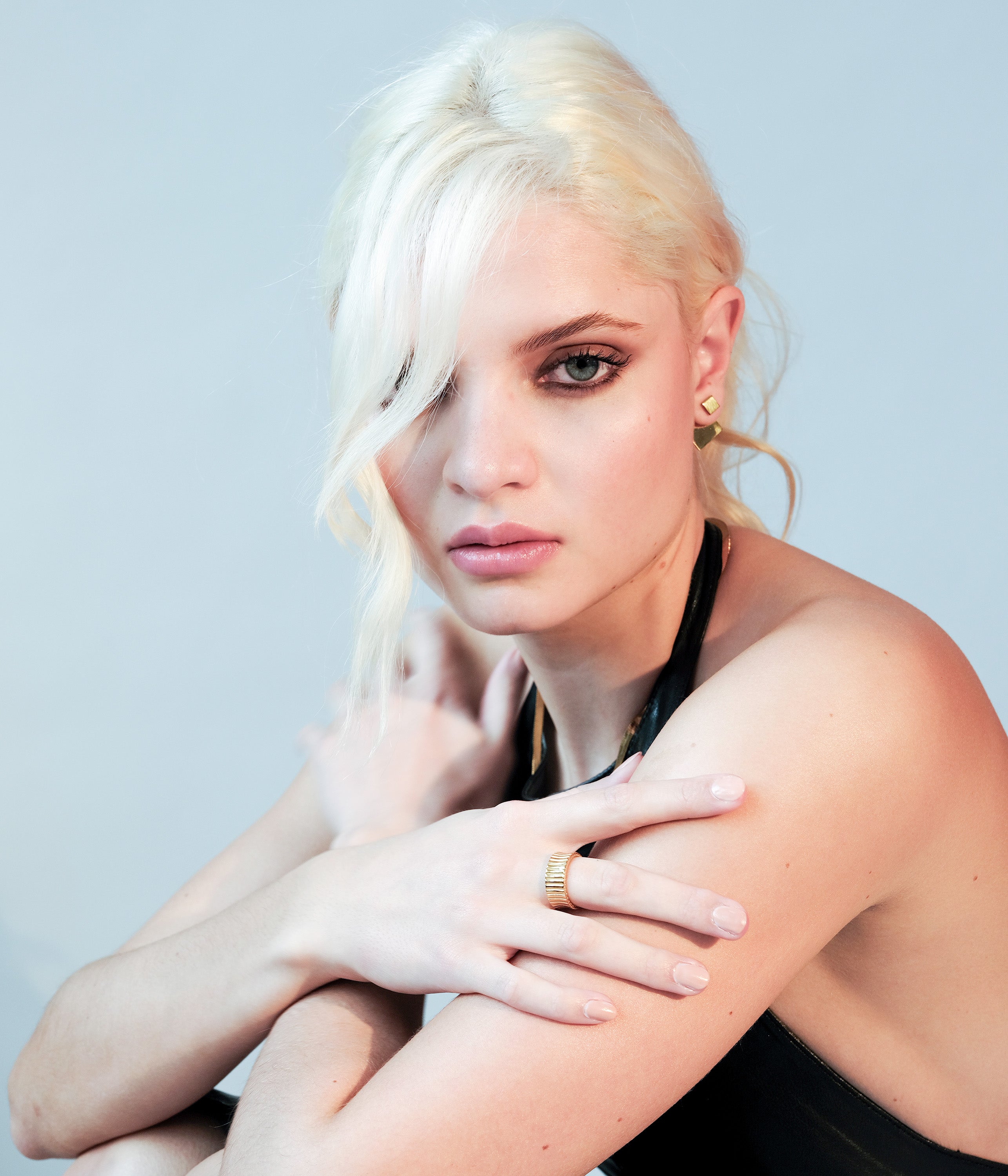 Side view of the Revolve Rhomb Earrings on a model - 18k gold earrings
