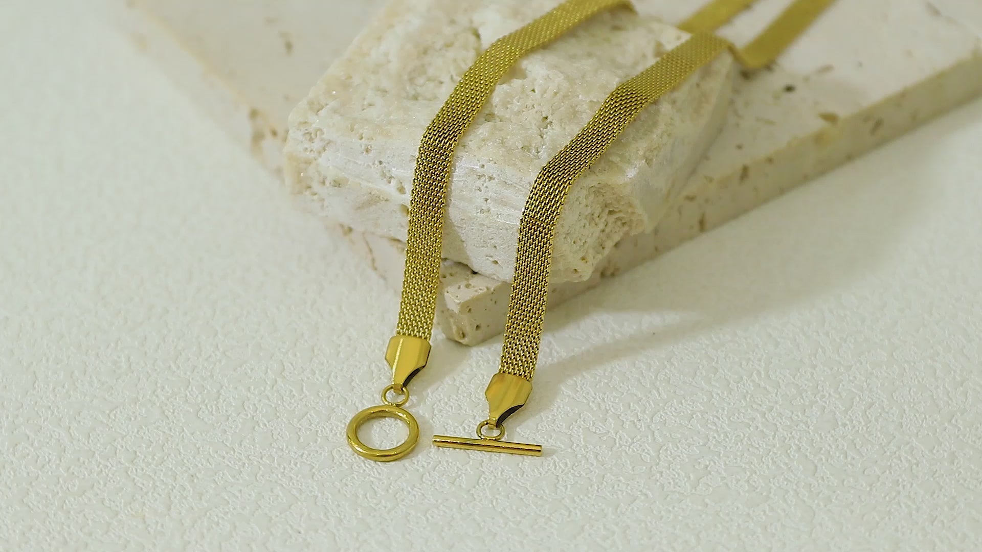 Close-up video of the Dominion Necklace in motion, highlighting the lush gold surface, durable craftsmanship, and stylish clasp.
