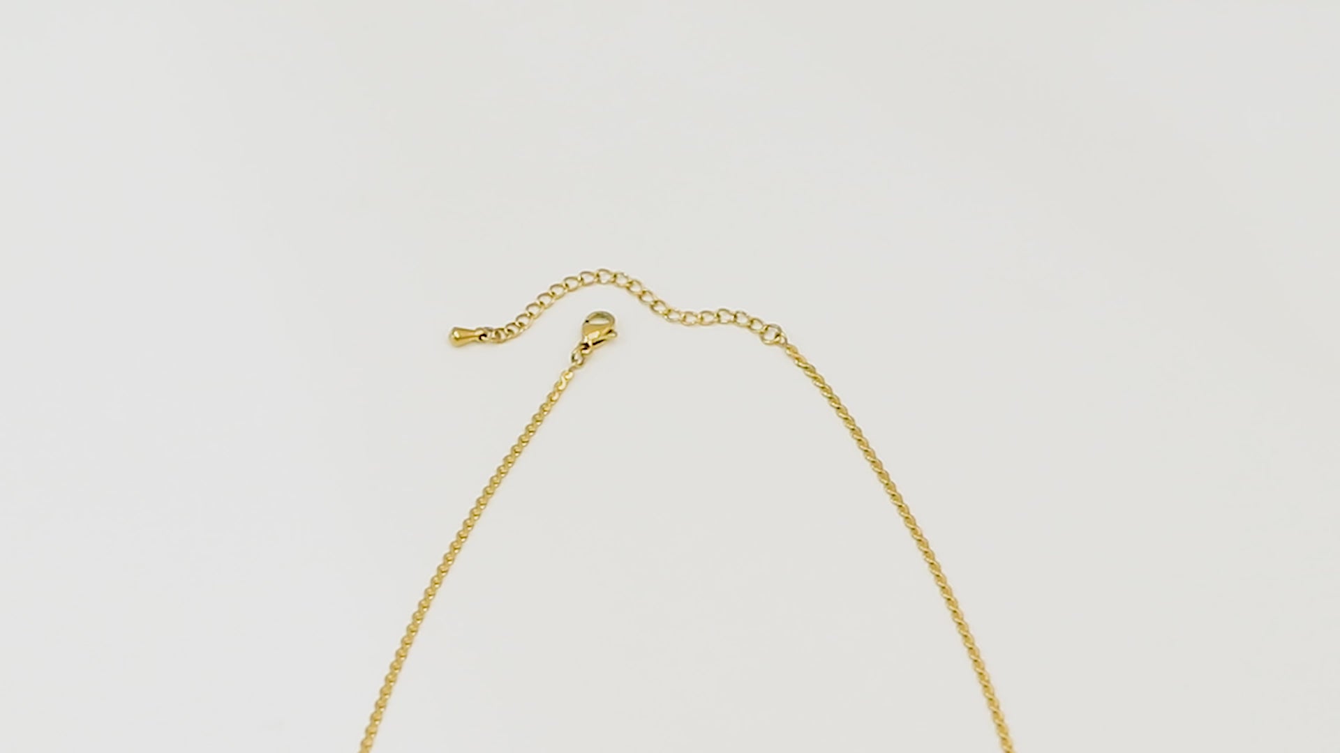 Top-down gold necklace video starting at the OT clasp and moving over the Allure Chain, showing its 1.8mm 14k gold links and smooth shine.