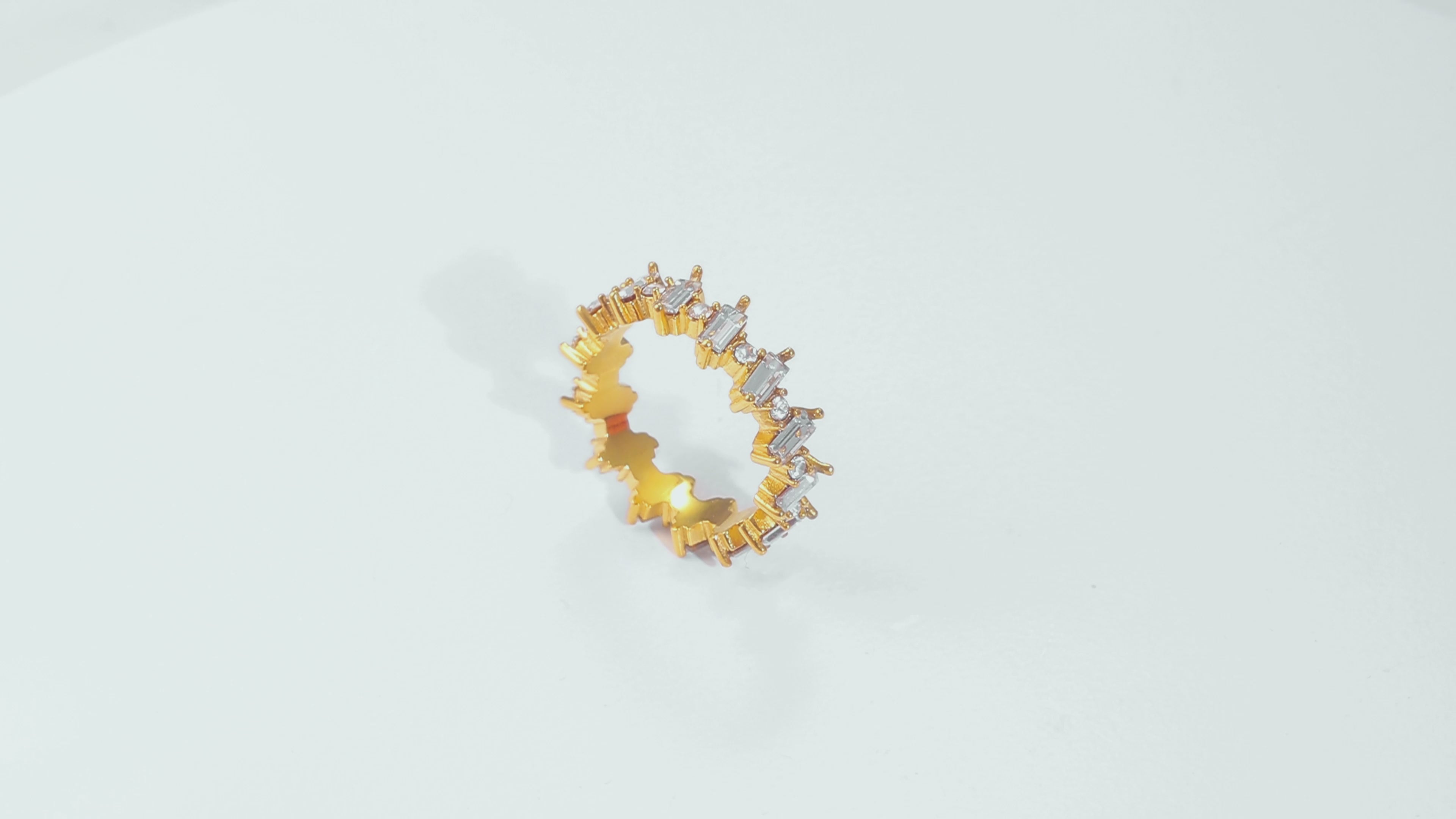 Video of the Crest Gold Ring rotating, showcasing the 18k gold coating, sparkling cubic zirconia accents, and sleek, hypoallergenic design.