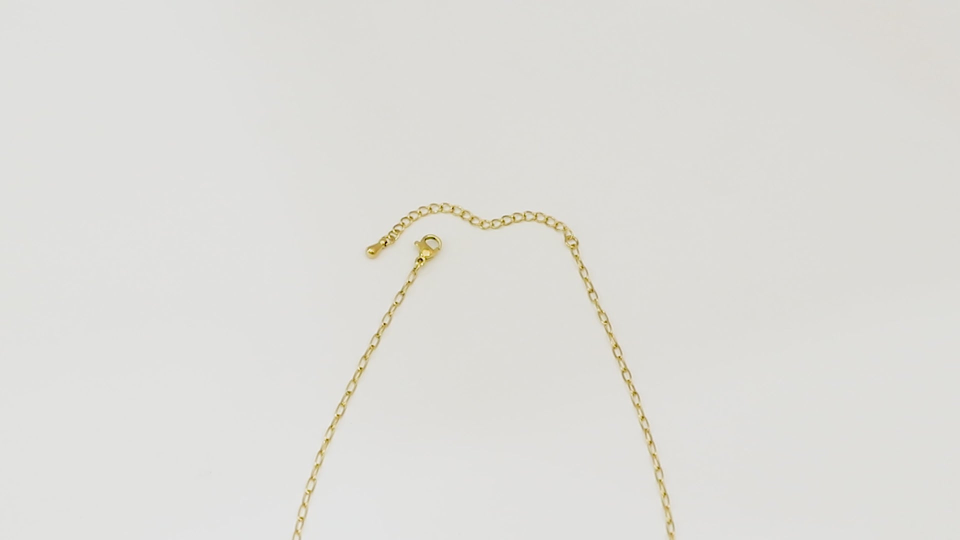 Close-up video of Vivid Chain, waterproof 18k gold chain with stainless steel base.