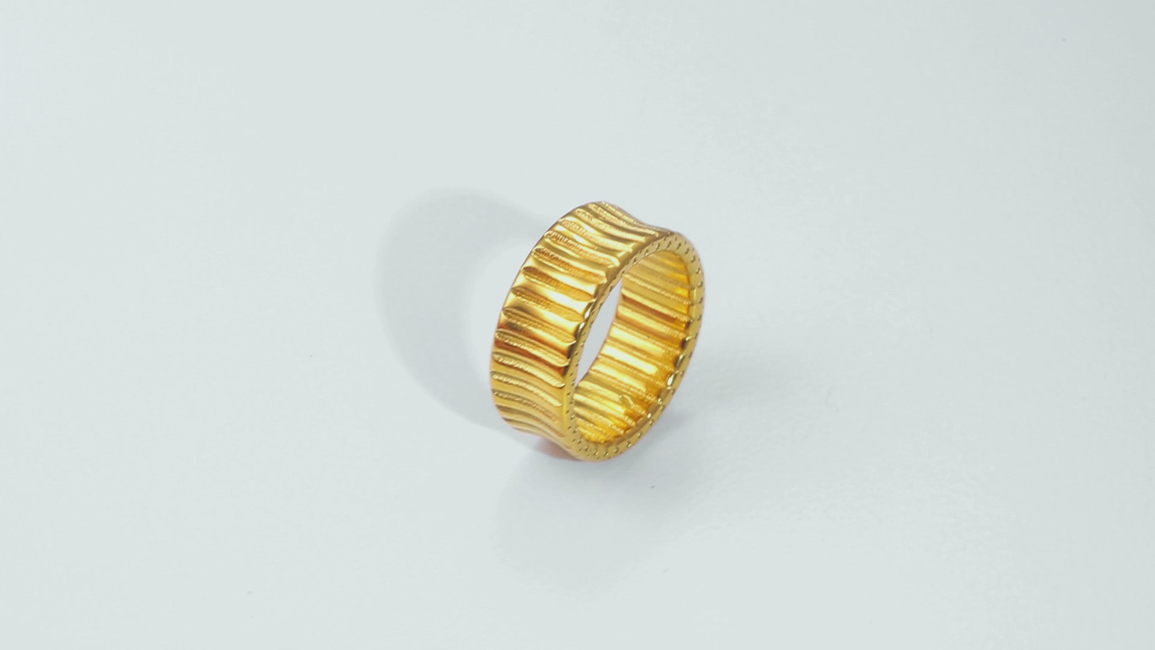 Video of the Gold Cleo Ring in motion, capturing the smooth 14k gold surface, stainless steel base, and modern design.
