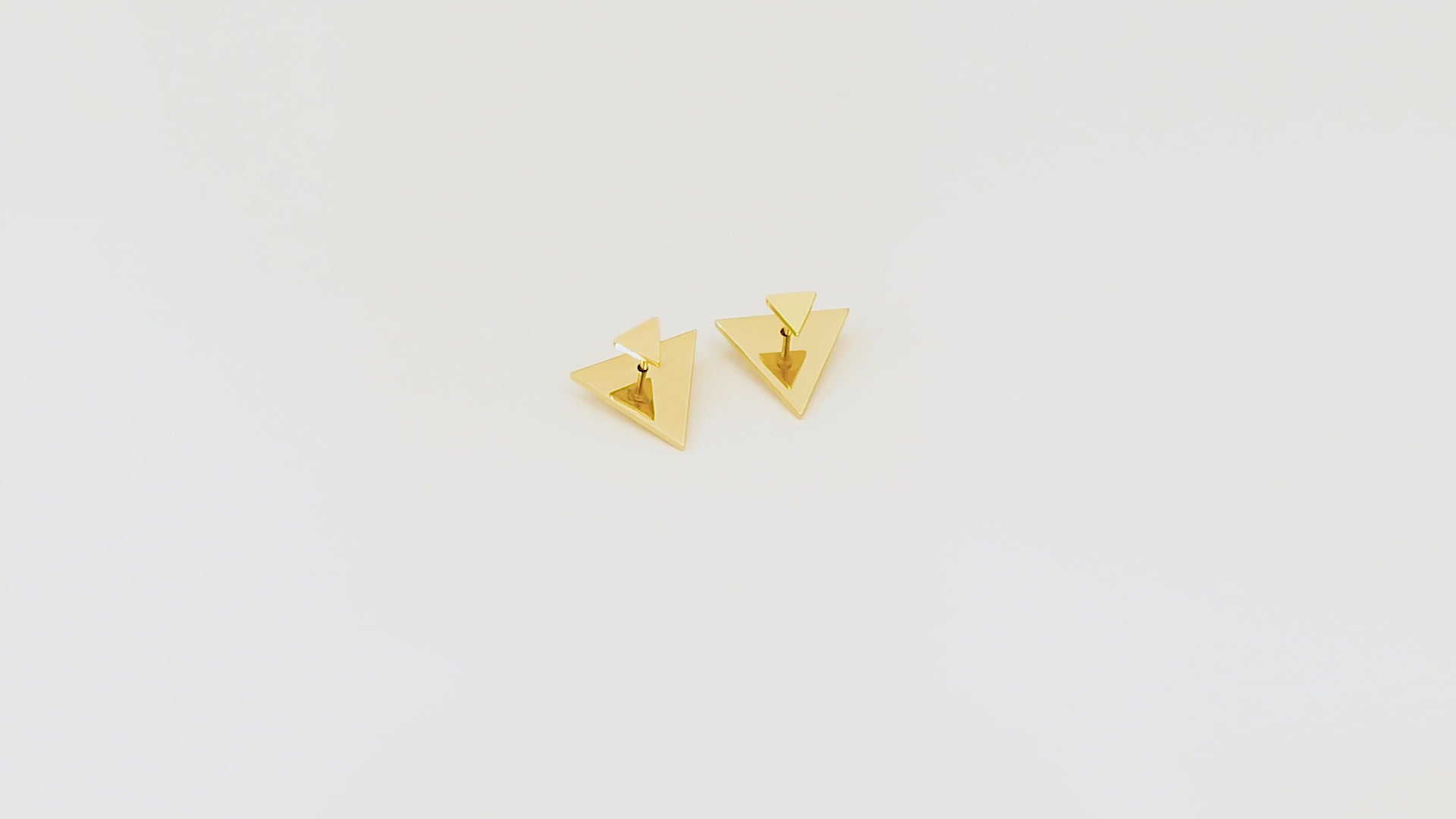 Video of the Revolve Arrow earrings showing the polished gold finish, 5x5mm front, 15x15mm back, and unique Revolve Closure.