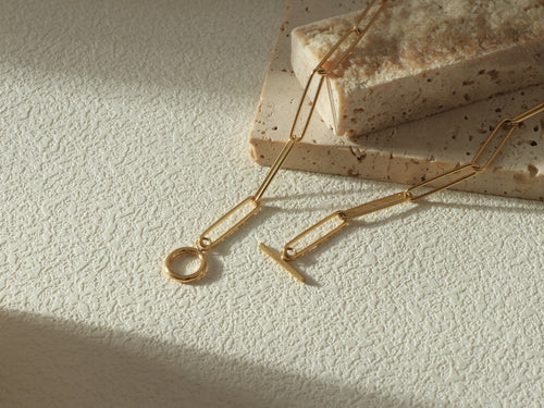 Close-up flat lay of the Unity Chain, focusing on the 14k gold links closure pattern - Gold coated on stainless steel base