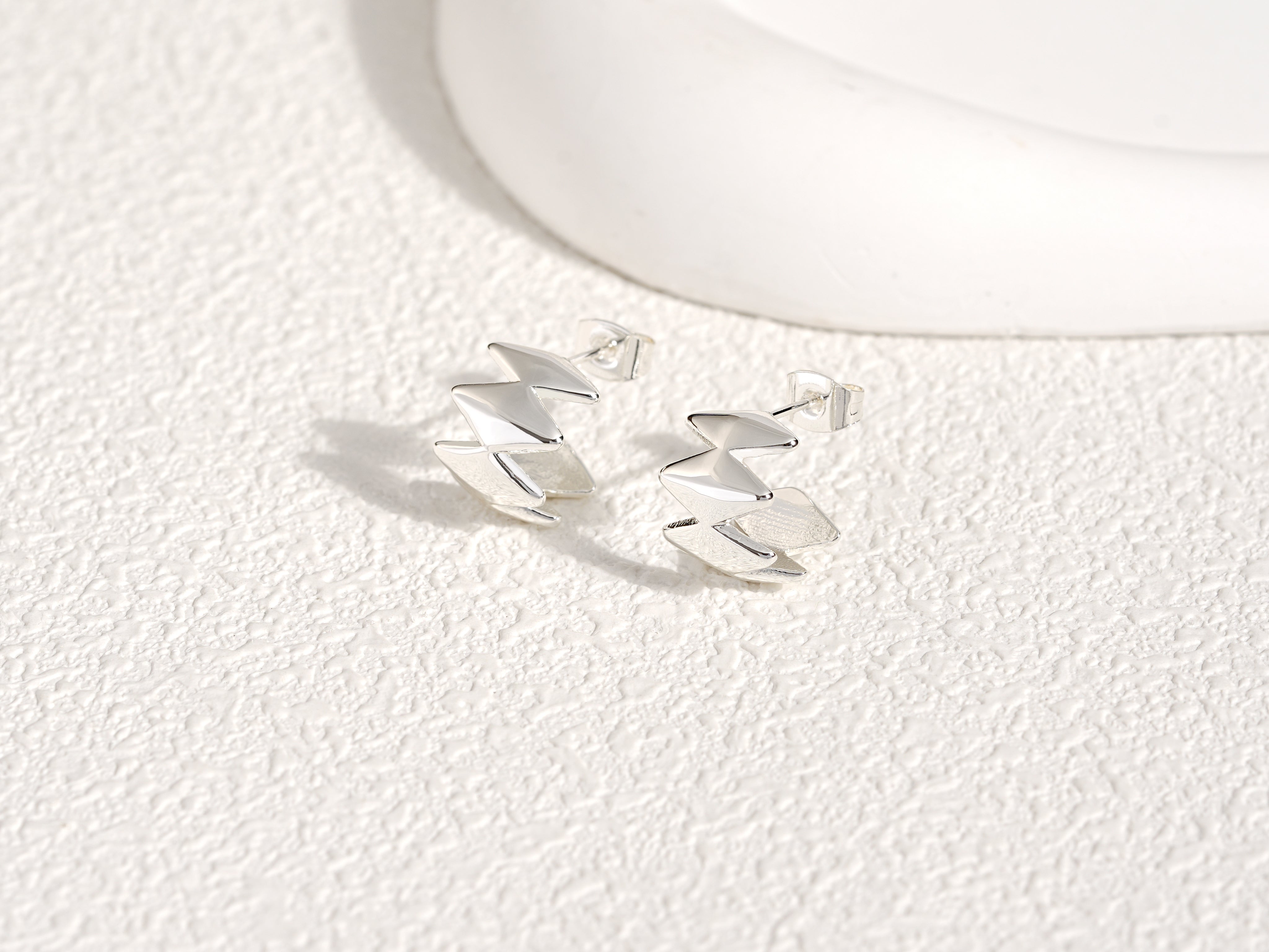 Edgy Silver Earrings, designed by Rebeca Sá