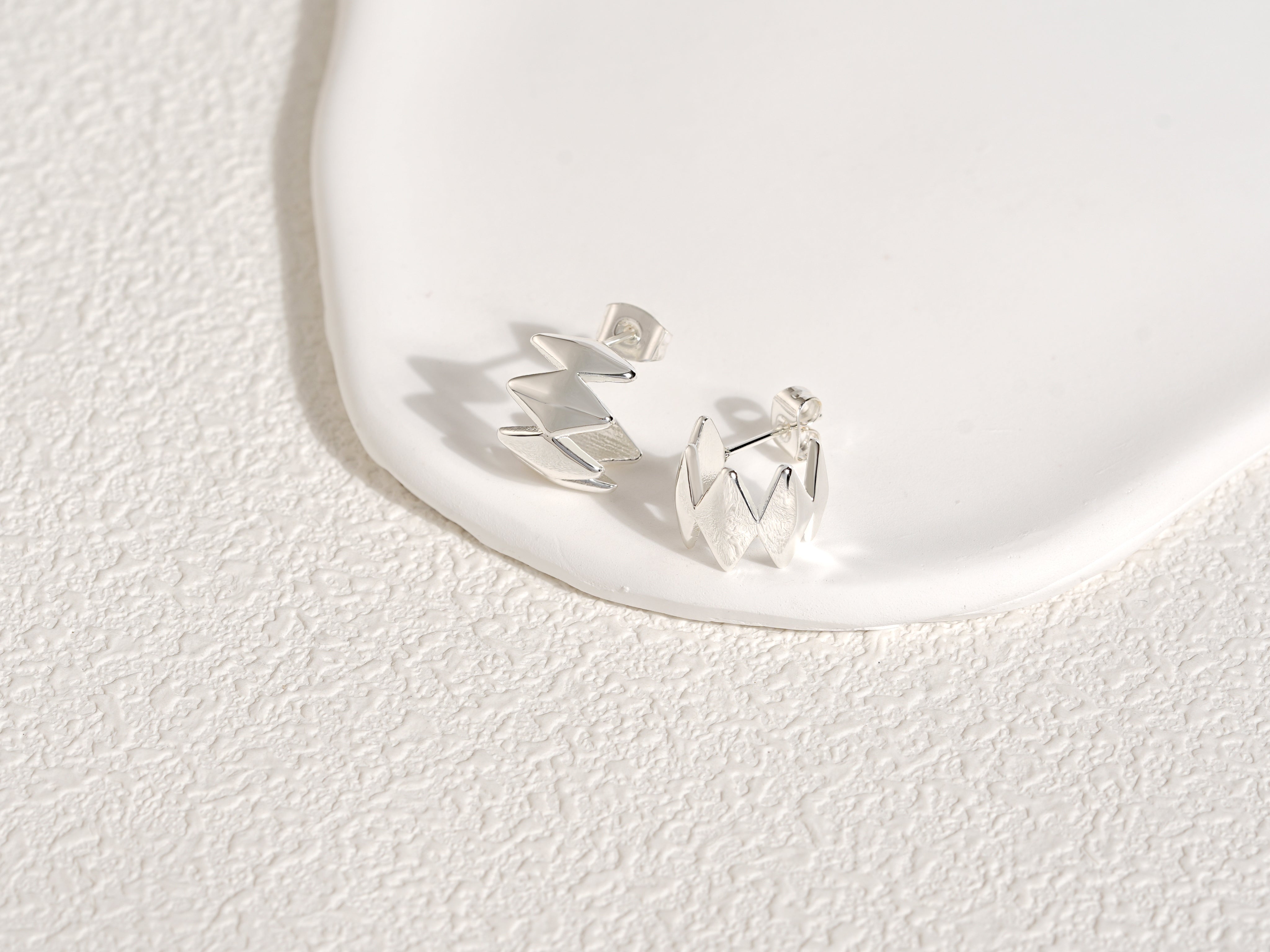 Edgy Silver Earrings, designed by Rebeca Sá