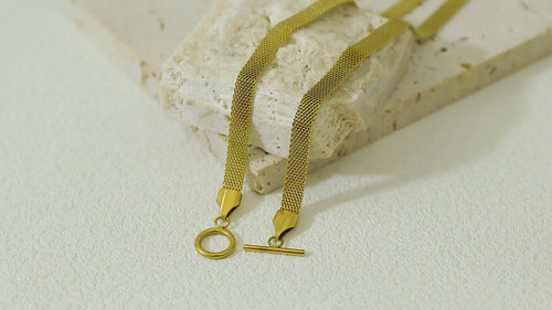 Close-up video of the Dominion Necklace in motion, highlighting the lush gold surface, durable craftsmanship, and stylish clasp.