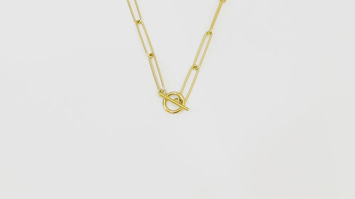 Close-up video of the Unity Chain against a white background, showcasing the 14k real gold design and smooth texture.