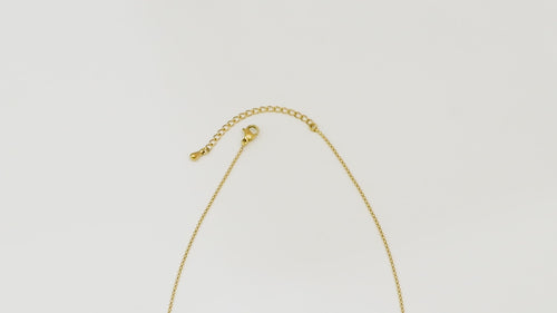 Top-down video panning over the Gold Grandeur Chain, starting at the clasp and moving along the full length to highlight its fine gold links and modern OT closure.