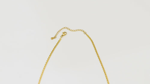 Top-down video panning across the Allure Chain, starting at the clasp, capturing the full length and shimmering 18k gold finish.